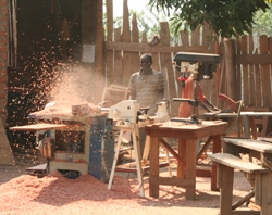 A carpentry student at work in the Yei VTC.